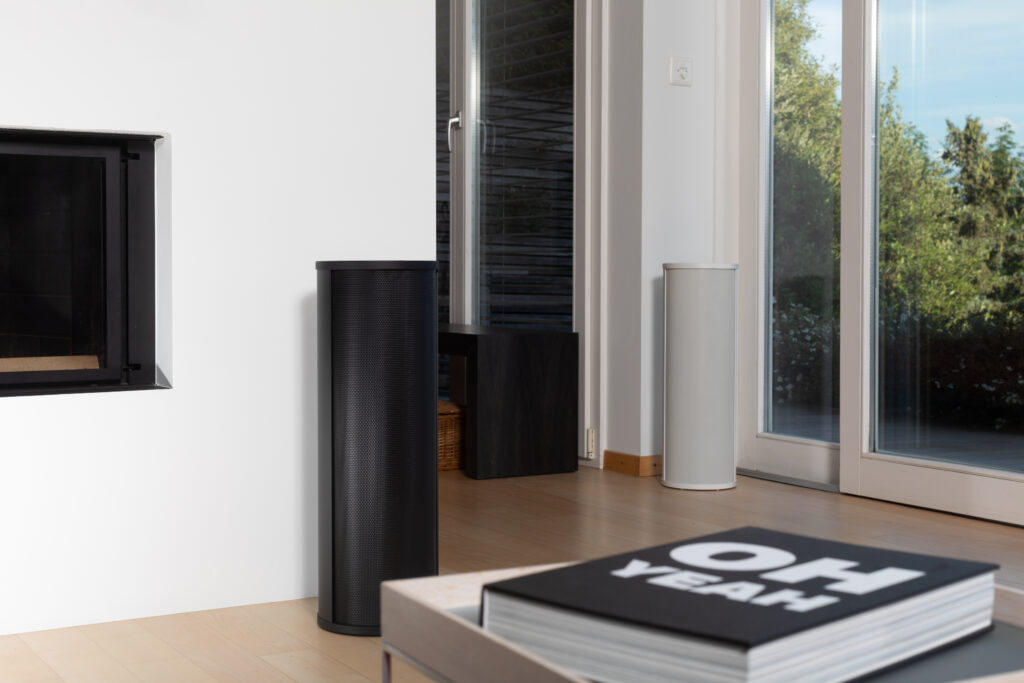 White and black AVAA C214s in living room
